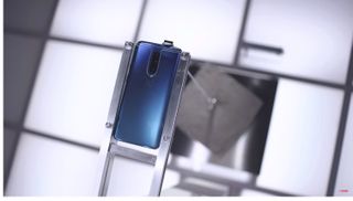 OnePlus claims that the OnePlus 7 Pro can lift a 49-pound cement block. Credit: OnePlus