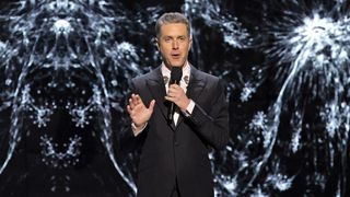 Geoff Keighley speaking into a microphone at the 2021 Game Awards.