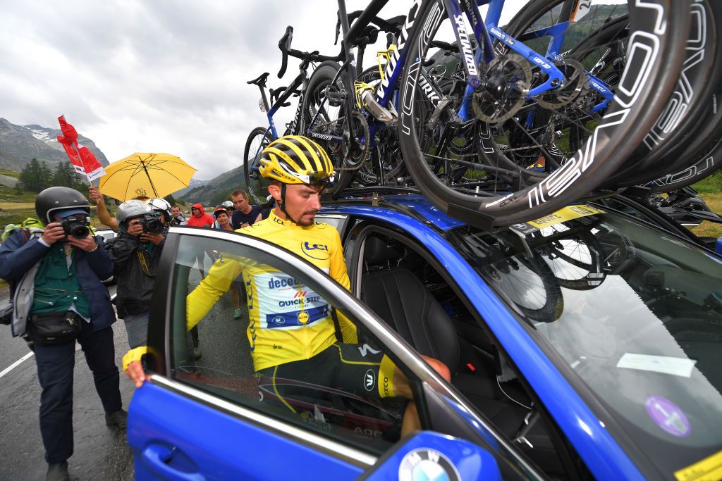 Alaphilippe gets into a team car after the stage