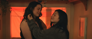 Lily Gladstone and Kelly Marie Tran embracing in The Wedding Banquet