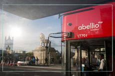 A close up of a London bus with the Waterloo lion in the background