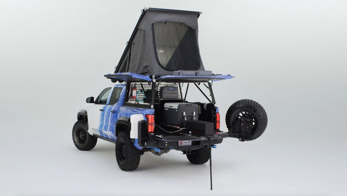 A Tacoma H2-Overlander truck in a studio