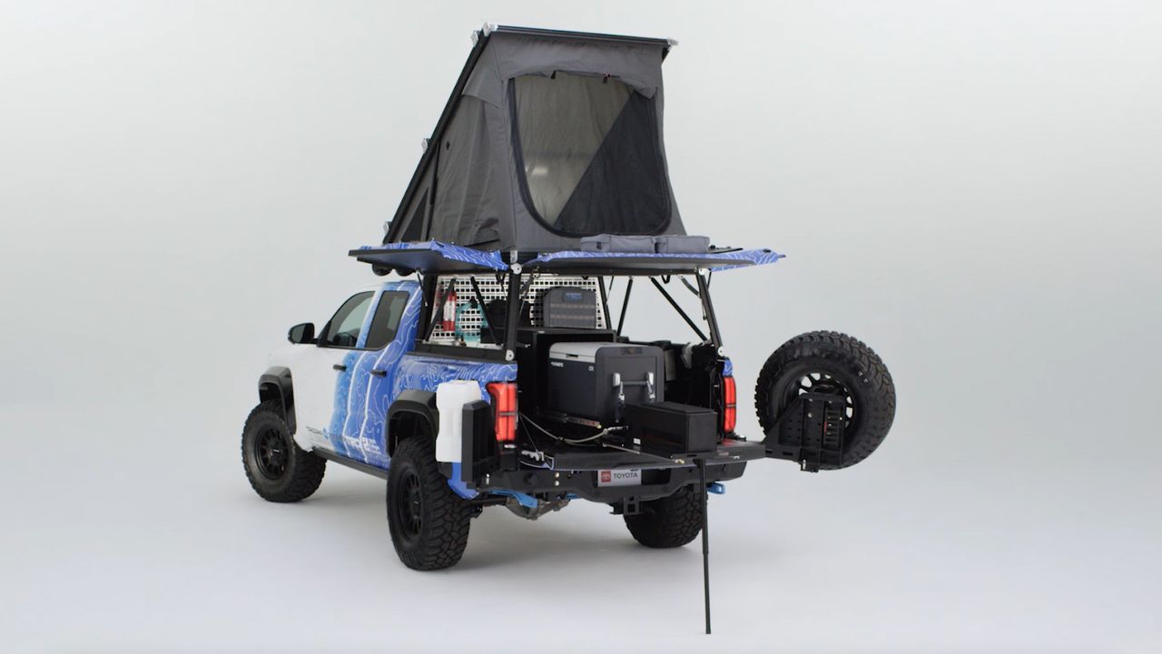 A Tacoma H2-Overlander truck in a studio