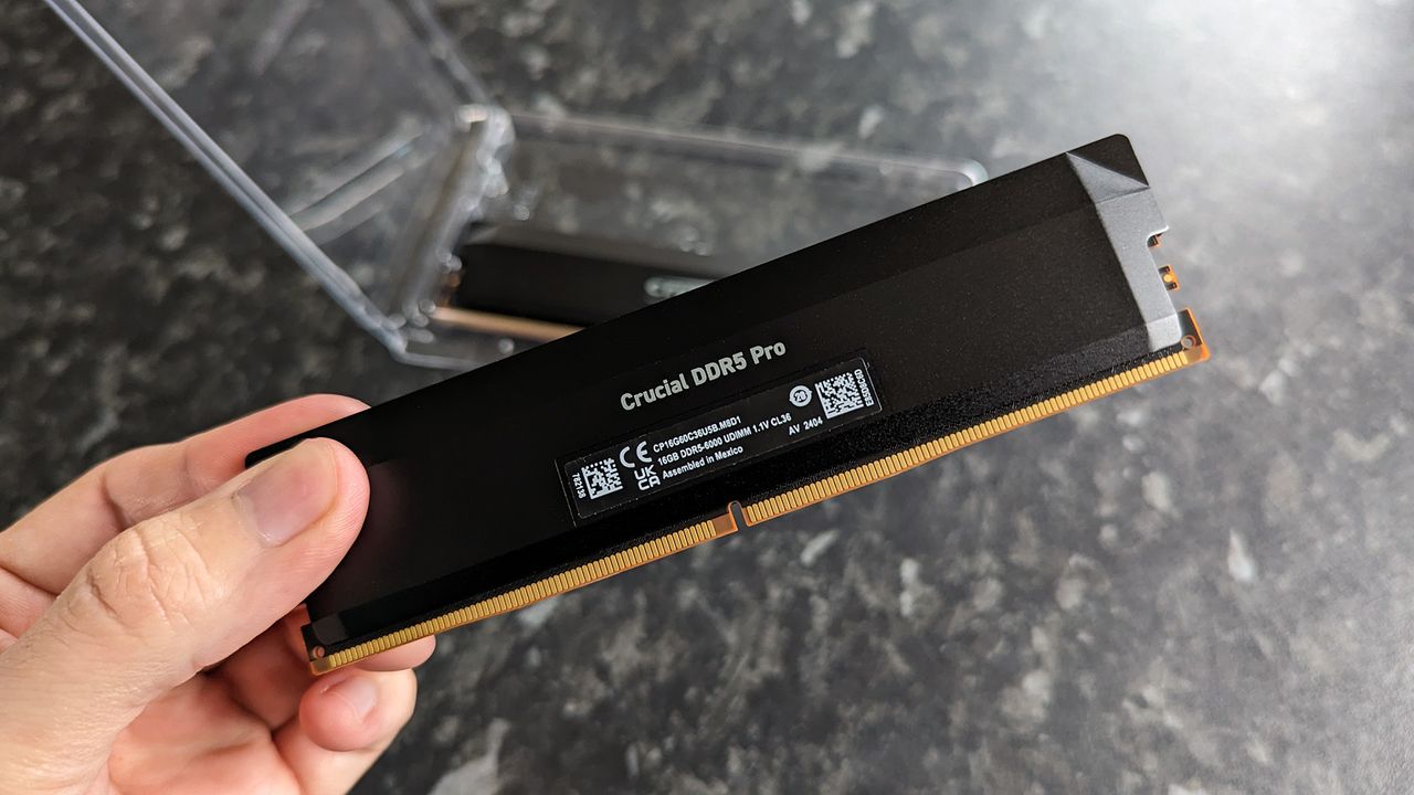 Crucial Pro Series Overclocking Edition DDR5 RAM held in hand with specifications shown