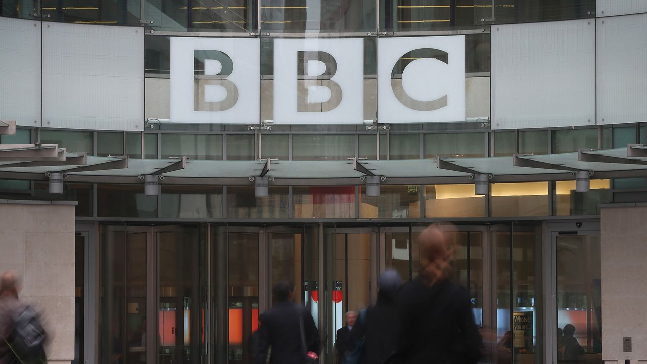 Staff entering BBC Broadcasting House in London.