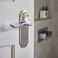 White door with chrome handle