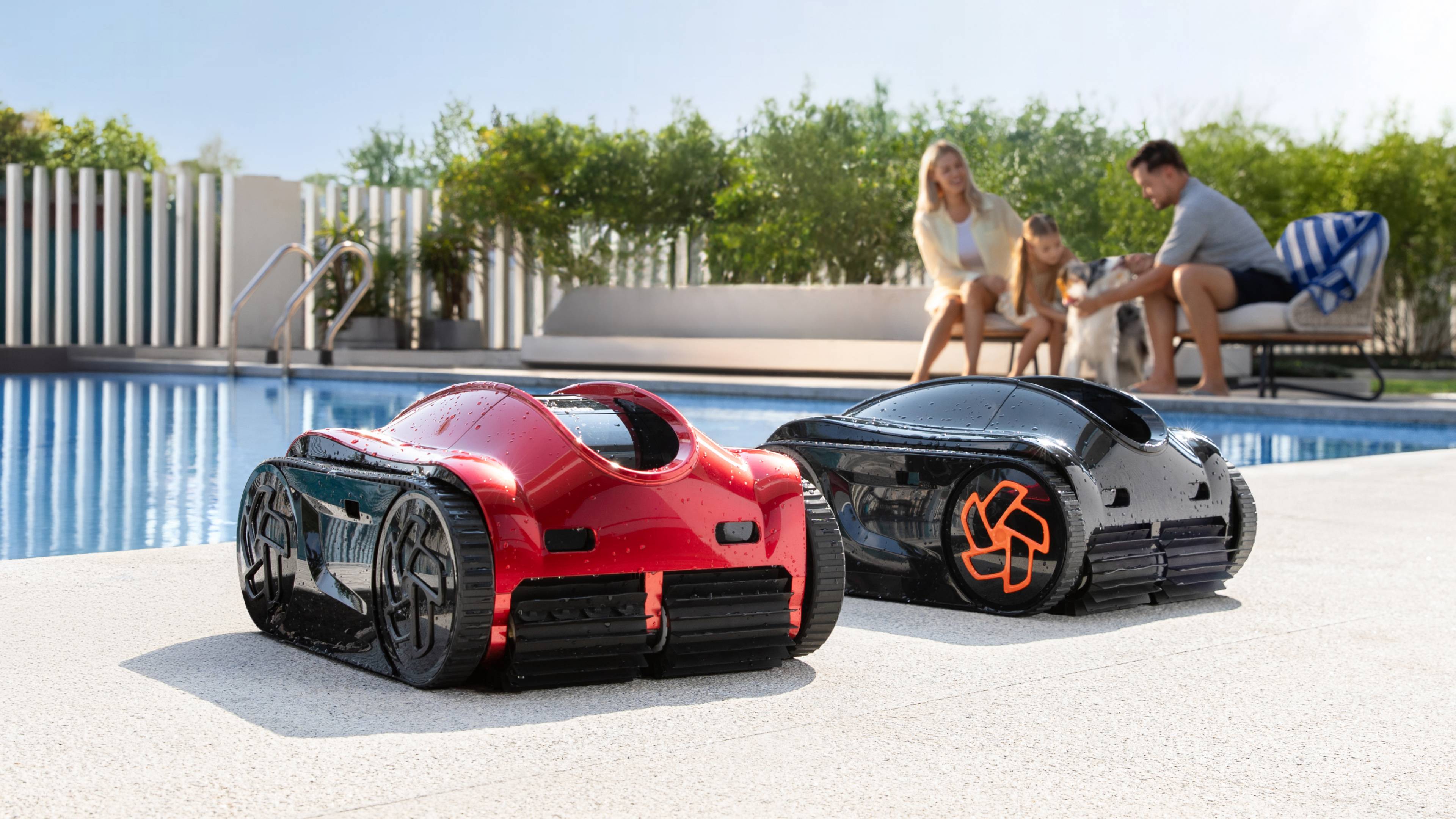 Two versions of the iGarden Pool Cleaner K with a family in the background