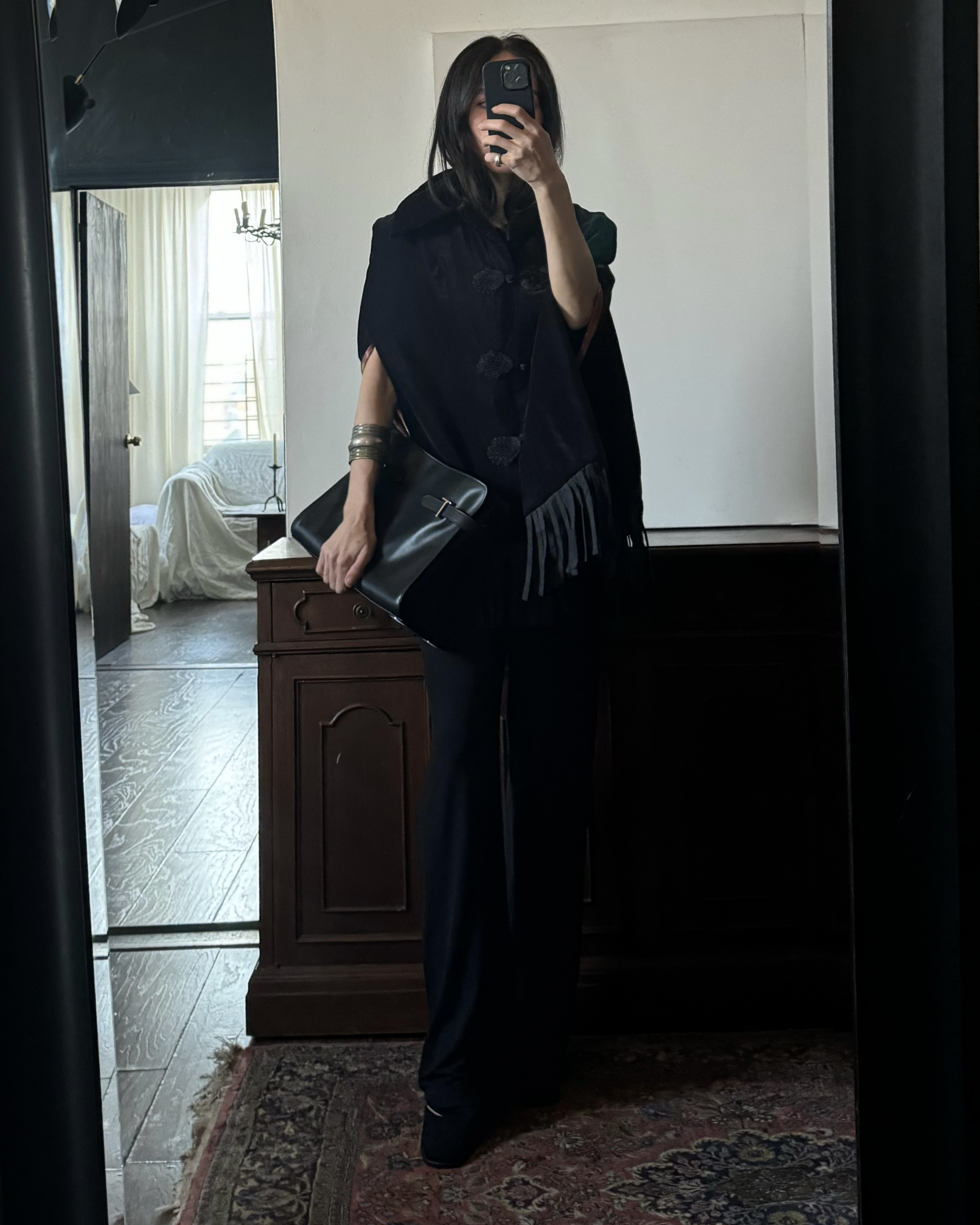 Alexis Badiyi wearing a fringed cape