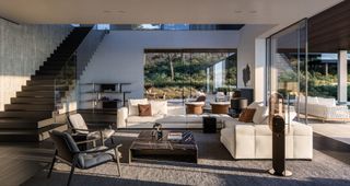 In one of the resort’s residencies, white Blazer sofa by Rodolfo Dordoni, Fynn chairs by GamFratesi and Linha coffee table by Marcio Kogan / studio mk27
