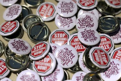 Buttons with anti-death penalty slogans are seen during a vigil against the death penalty in front of the U.S. Supreme Court on June 29, 2021