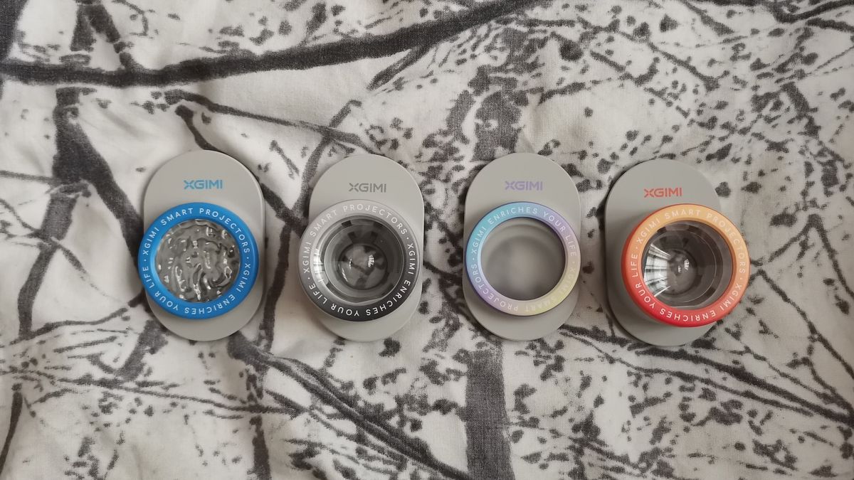 The XGIMI MoGo 4 Laser projector set-up with various accessories.