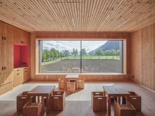 Large windows looking out to nature at this Austrian Kindergarten