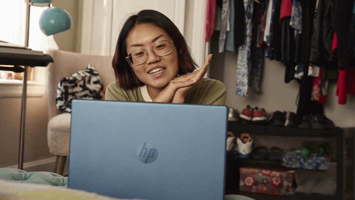 Woman using a HP 2-in-1 laptop