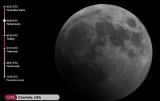 close up view of the moon with a shadow in the bottom left corner