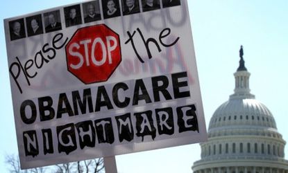Tea Party supporters protest outside the Supreme Court where justices Wednesday will consider if President Obama's health care can survive without the individual mandate.