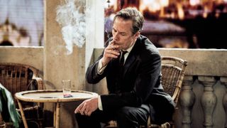 Kim Philby (Guy Pearce) smoking in A Spy Among Friends