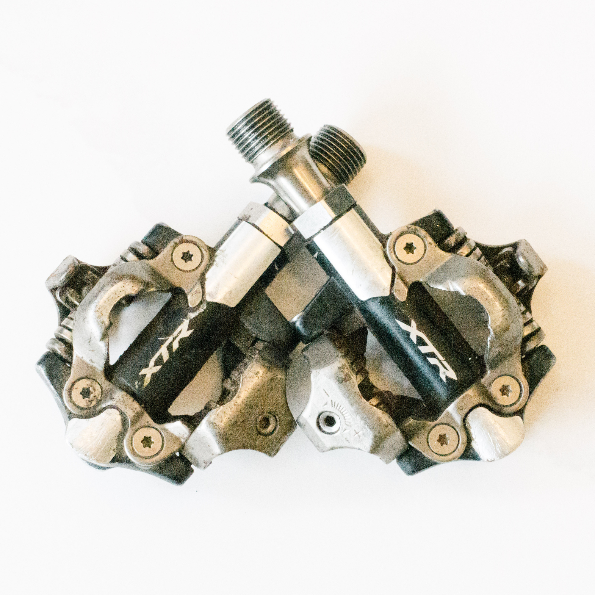 Pair of Shimano XTR clipless pedals on a white background 