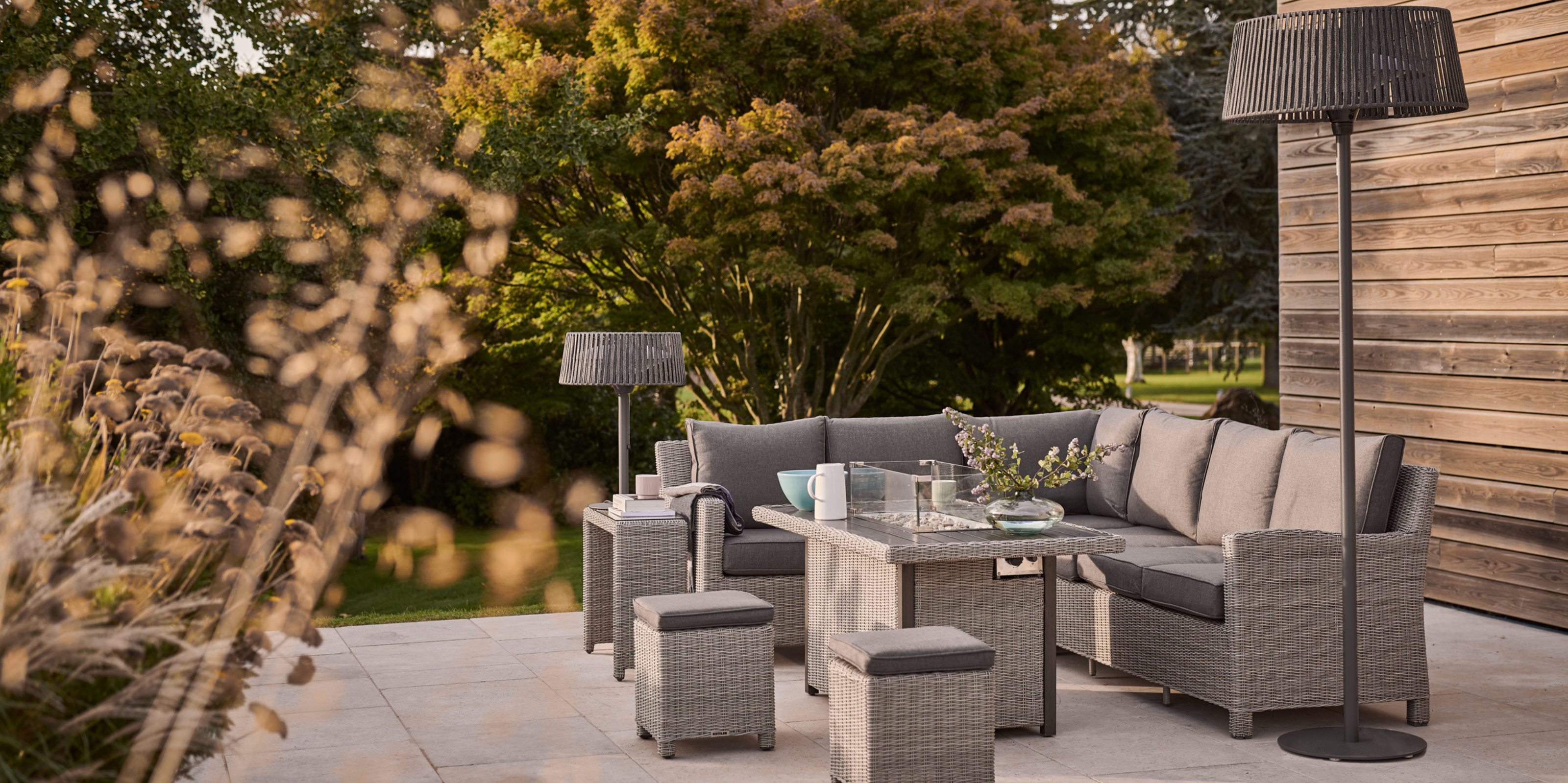 stainless steel table heater lamp on an outdoor living room setup