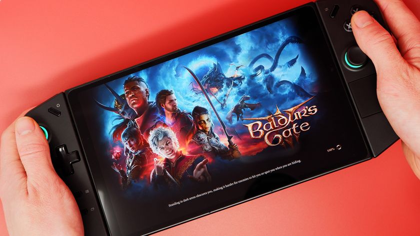 The Lenovo Legion Go on a red background and playing Baldur&#039;s Gate 3.