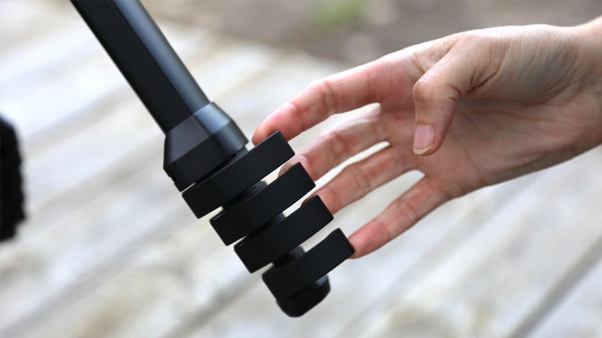 Peak Design Travel Tripod Review: Image shows hands manipulating tripod