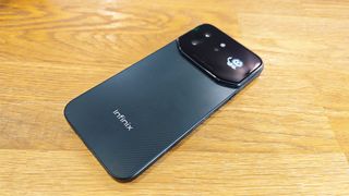 Image of the Infinix Note 60 Ultra sitting on a wooden table