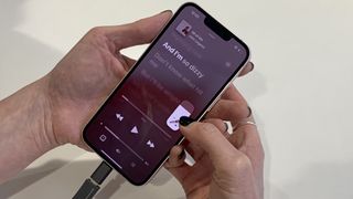 Apple Music Sing on an iPhone, held in your hand