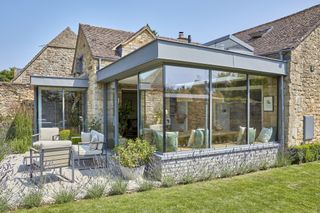 extension with patio area surrounded by lavender plants