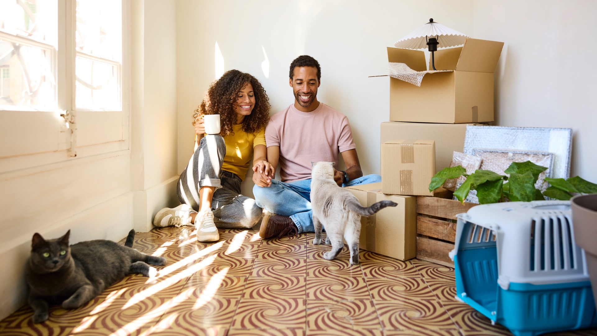Couple at home with two cats