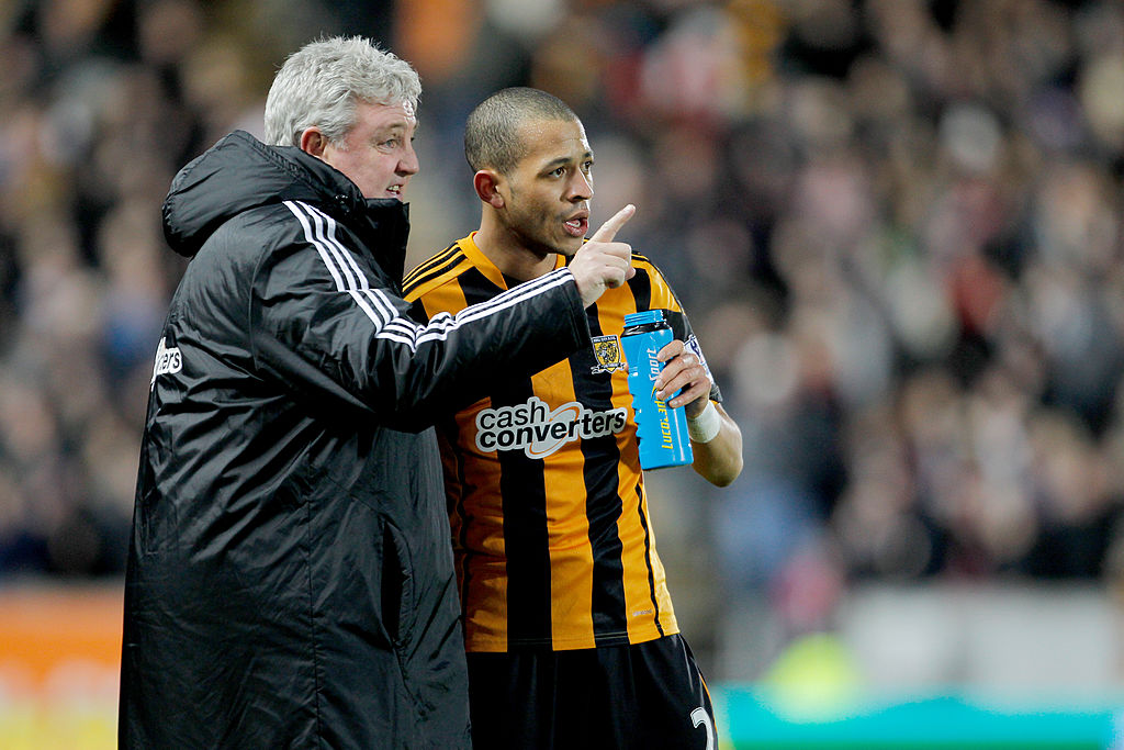 Steve Bruce, manager of Hull City and Liam Rosenior of Hull City during the Barclays Premier League match between Hull City and Fulham at KC stadium on December 28, 2013 in Hull, England.
