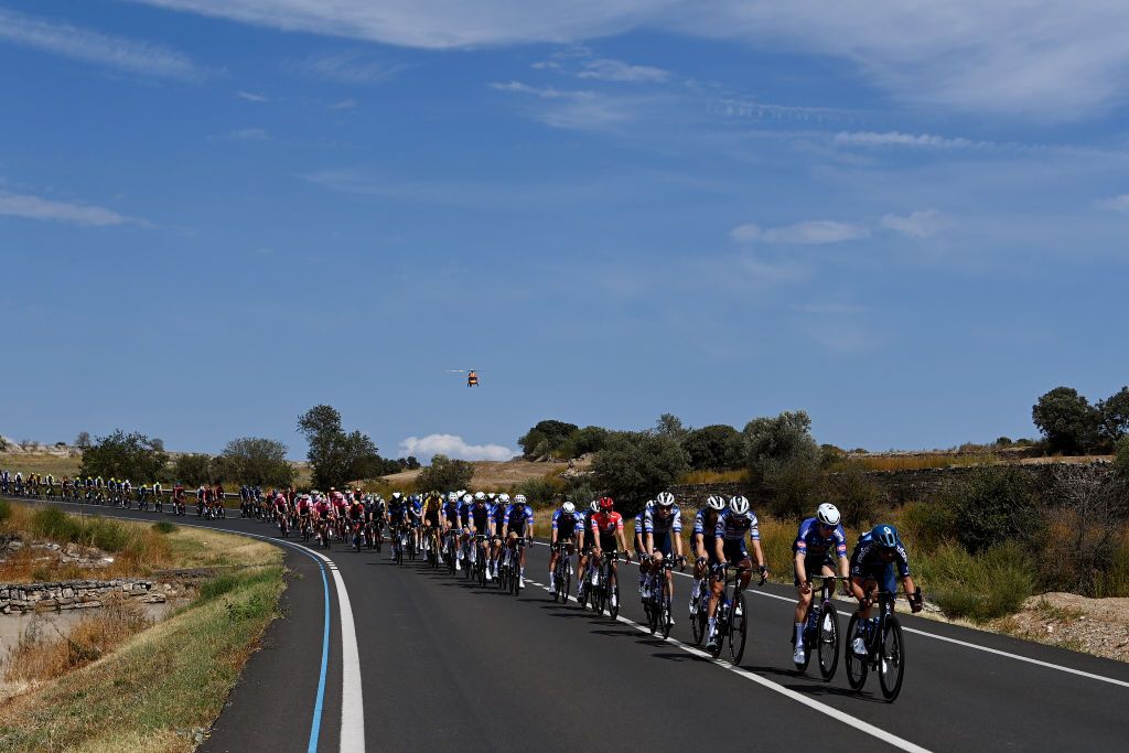 TARRAGONA SPAIN AUGUST 29 A general view of Remco Evenepoel of Belgium Louis Vervaeke of Belgium Mattia Cattaneo of Italy Andrea Bagioli of Italy Jan Hirt of Czech Republic James Knox of The United Kingdom Casper Pedersen of Denmark Pieter Serry of Belgium and Team Soudal Quick Step and Romain Bardet of France Romain Combaud of France Lorenzo Milesi of Italy Alberto Dainese of Italy Sean Flynn of The United Kingdom Chris Hamilton of Australia Max Poole of The United Kingdom and Team DSM firmenich lead the peloton during the 78th Tour of Spain 2023 Stage 4 a 1846km stage from Andorra la Vella to Tarragona UCIWT on August 29 2023 in Tarragona Spain Photo by Tim de WaeleGetty Images