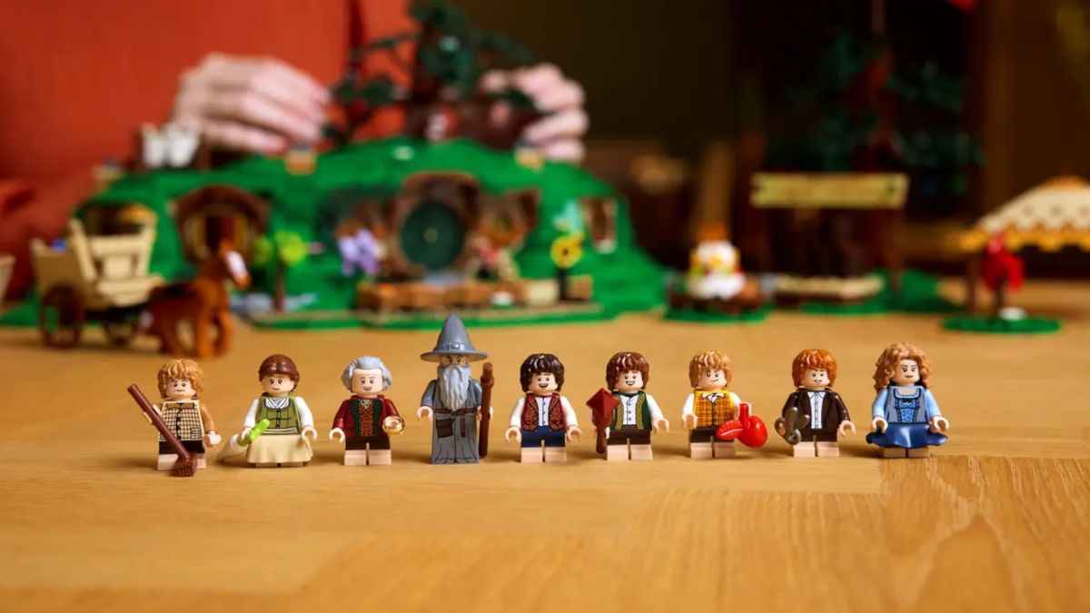 Lego The Shire minifigures on a wooden table in front of the set