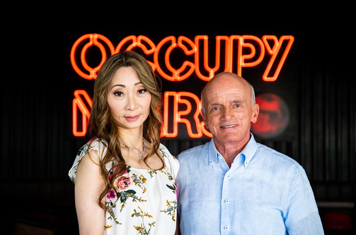 Dennis Tito, the world&#039;s first self-funded space tourist, and his wife Akiko pose for a photo at Starbase, SpaceX&#039;s Starship test facility in Boca Chica, Texas. The Titos have booked seats on the second Starship circumlunar flight.