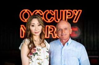 Dennis Tito, the world's first self-funded space tourist, and his wife Akiko pose for a photo at Starbase, SpaceX's Starship test facility in Boca Chica, Texas. The Titos have booked seats on the second Starship circumlunar flight.