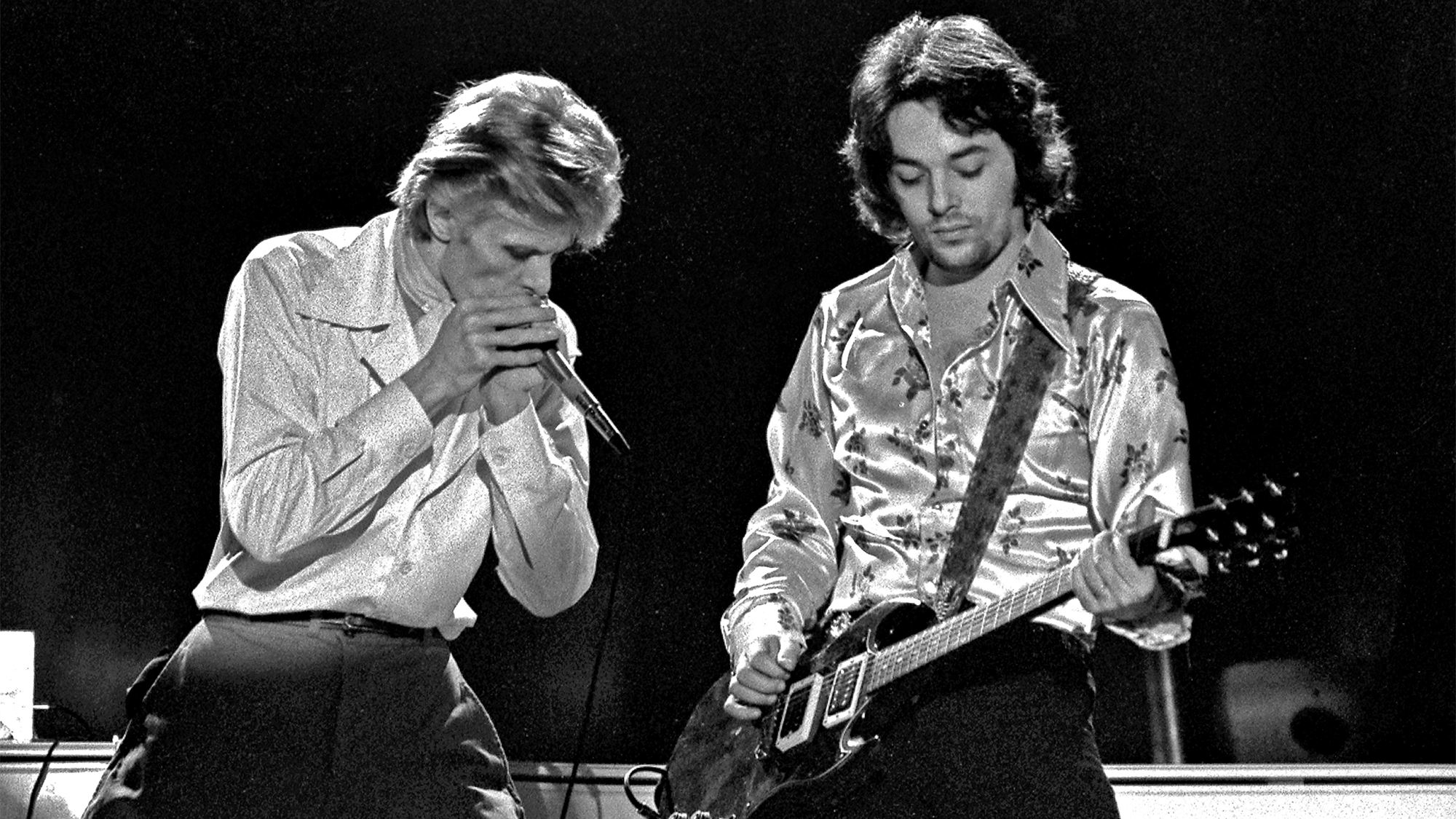 David Bowie and Earl Slick performing on David Bowies' Diamond Dogs Tour at the Boston Music Hall on November 15, 1974