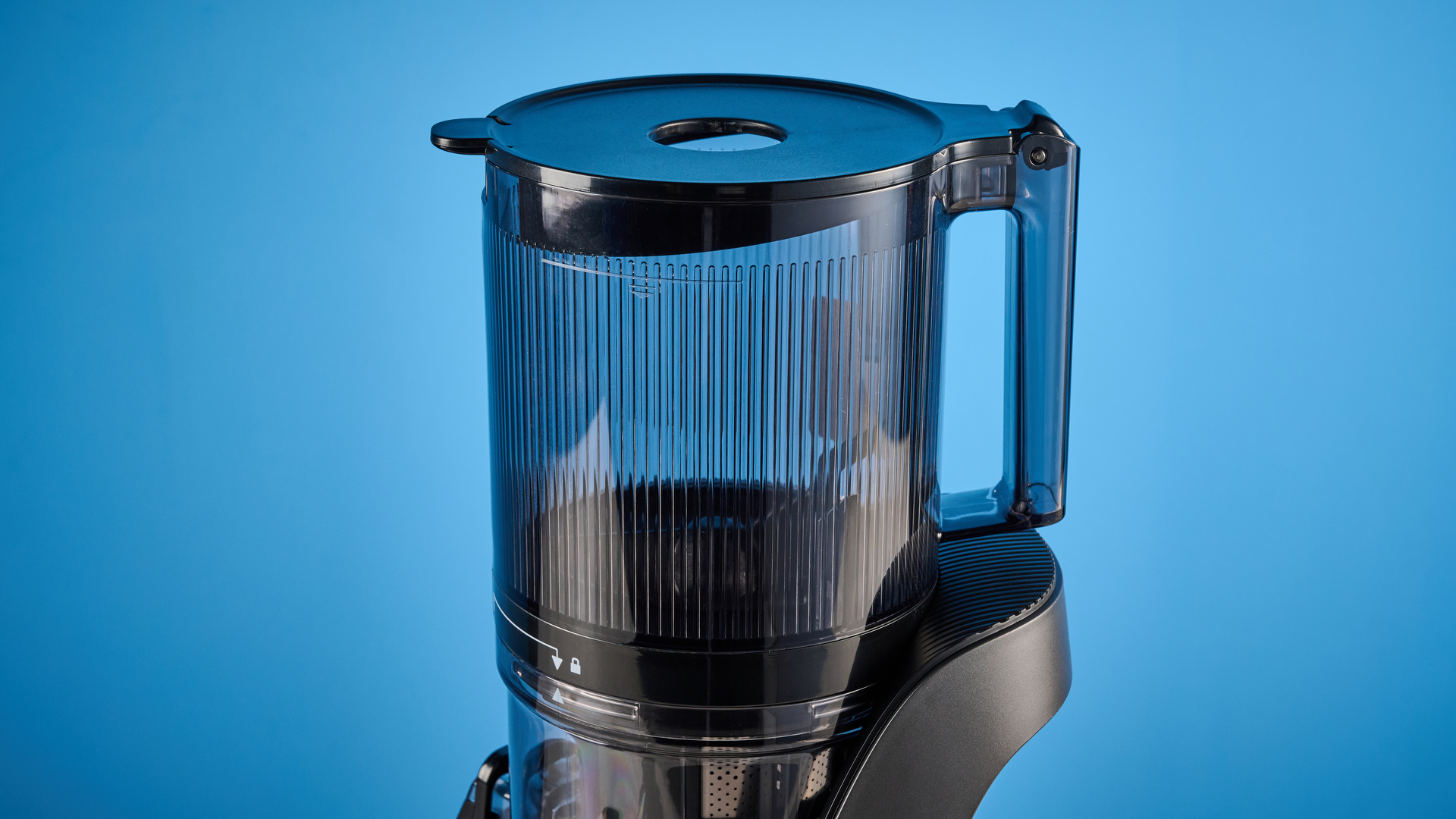 Canoly C16 Cold Press Juicer photographed in front of a blue background