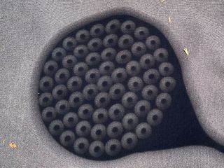 projection of ringlets of the annular solar eclipse through the holes of a spaghetti spoon.