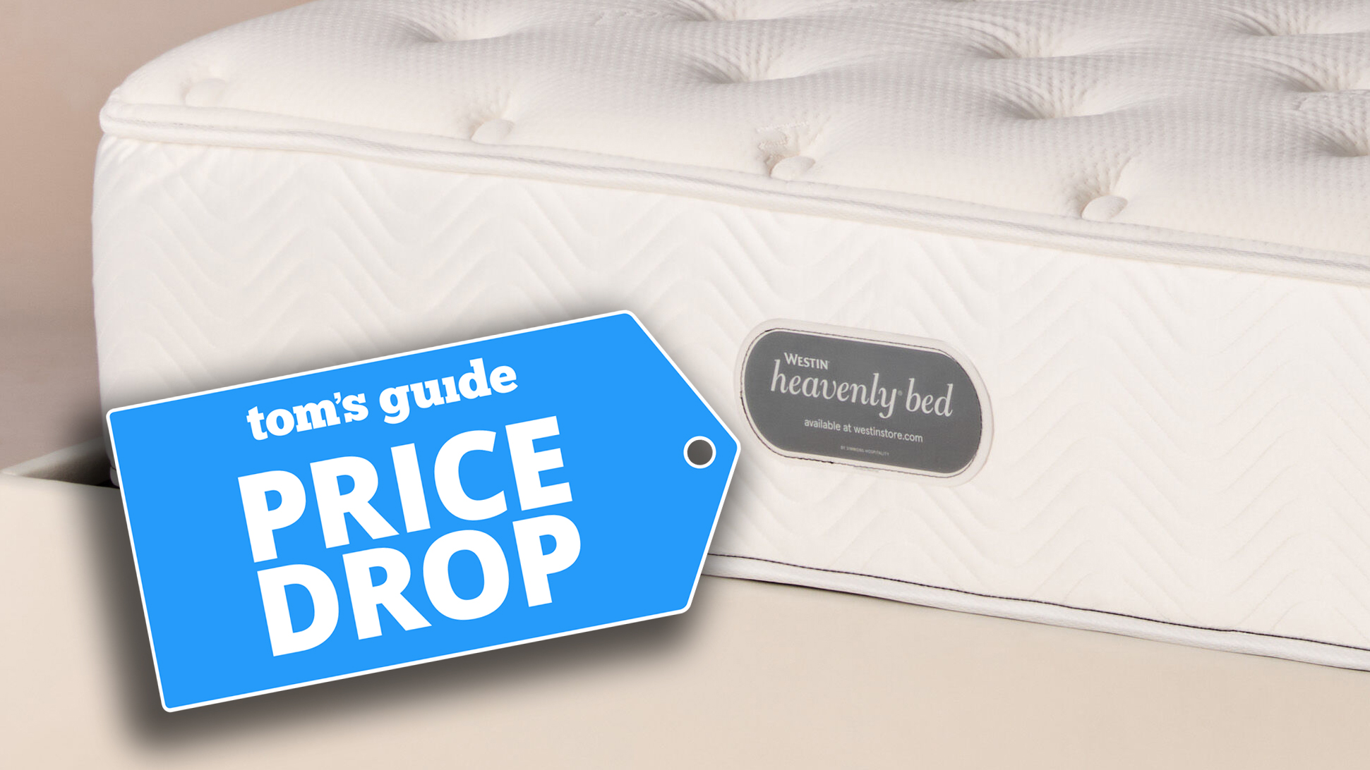A close up of the foot of the Westin Heavenly Bed hotel mattress showing the Westin Heavenly Bed label. A Tom&#039;s Guide Pride Drop deals badge is next to the lavel
