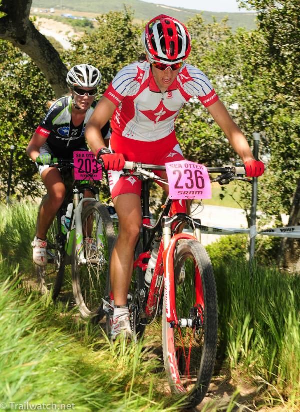 Lea Davison (Specialized) climbs through the trees