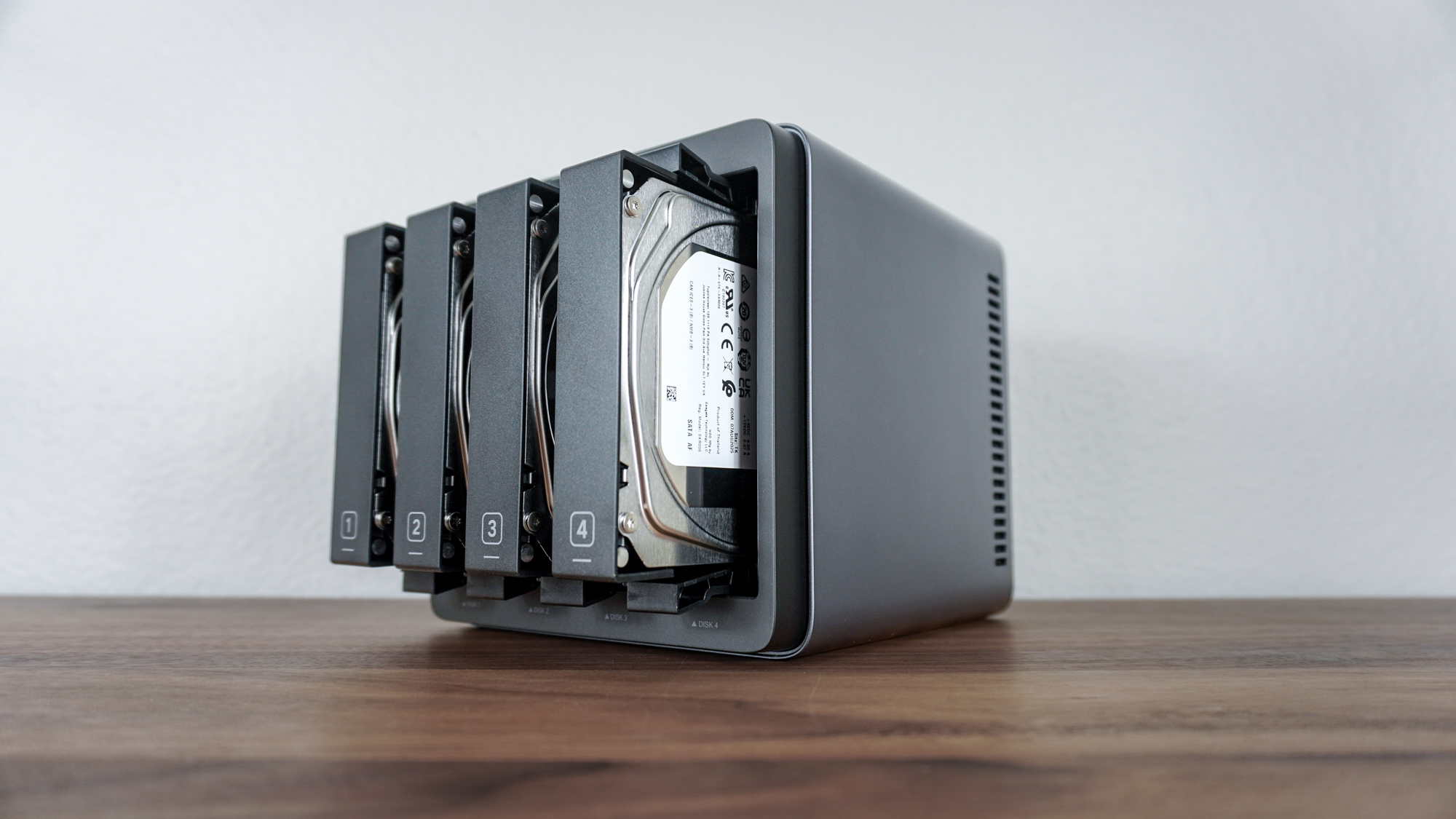 The Ugreen NASync DH4300 Plus with hard drives in each of its four drive bays