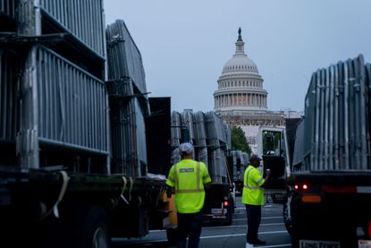 The U.S. Capitol building seen through barricades