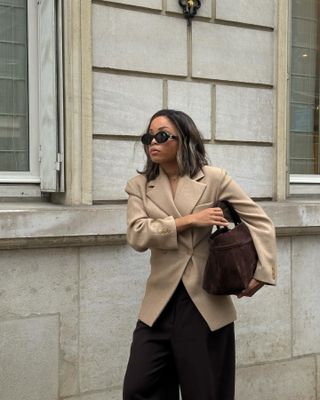 French woman in sharp blazer.