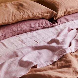Terracotta, Rosewater and Lavender Bedding Bundle on a bed.