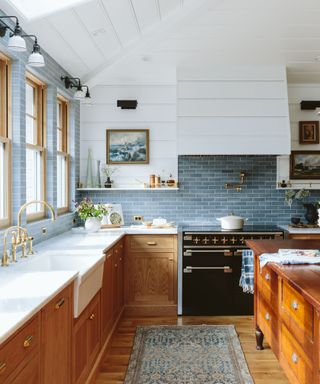 Wooden kitchen with blue tiled splashback