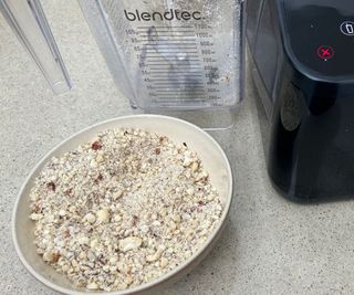 A bowl of nuts chopped in the Blendtec blender