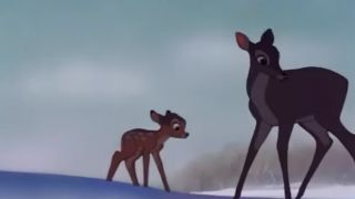 Bambi standing next to his mother on the snow.