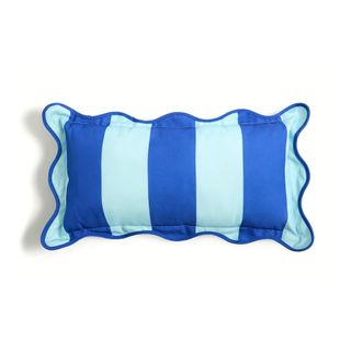 A blue stripe outdoor cushion with ruffle edge