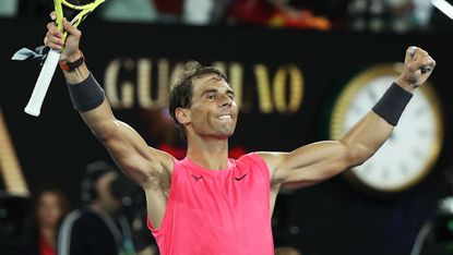 World No.1 Rafael Nadal celebrates after winning match point against Nick Kyrgios