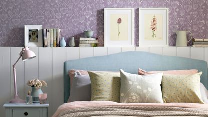 A bedroom with a bed with floral bedding