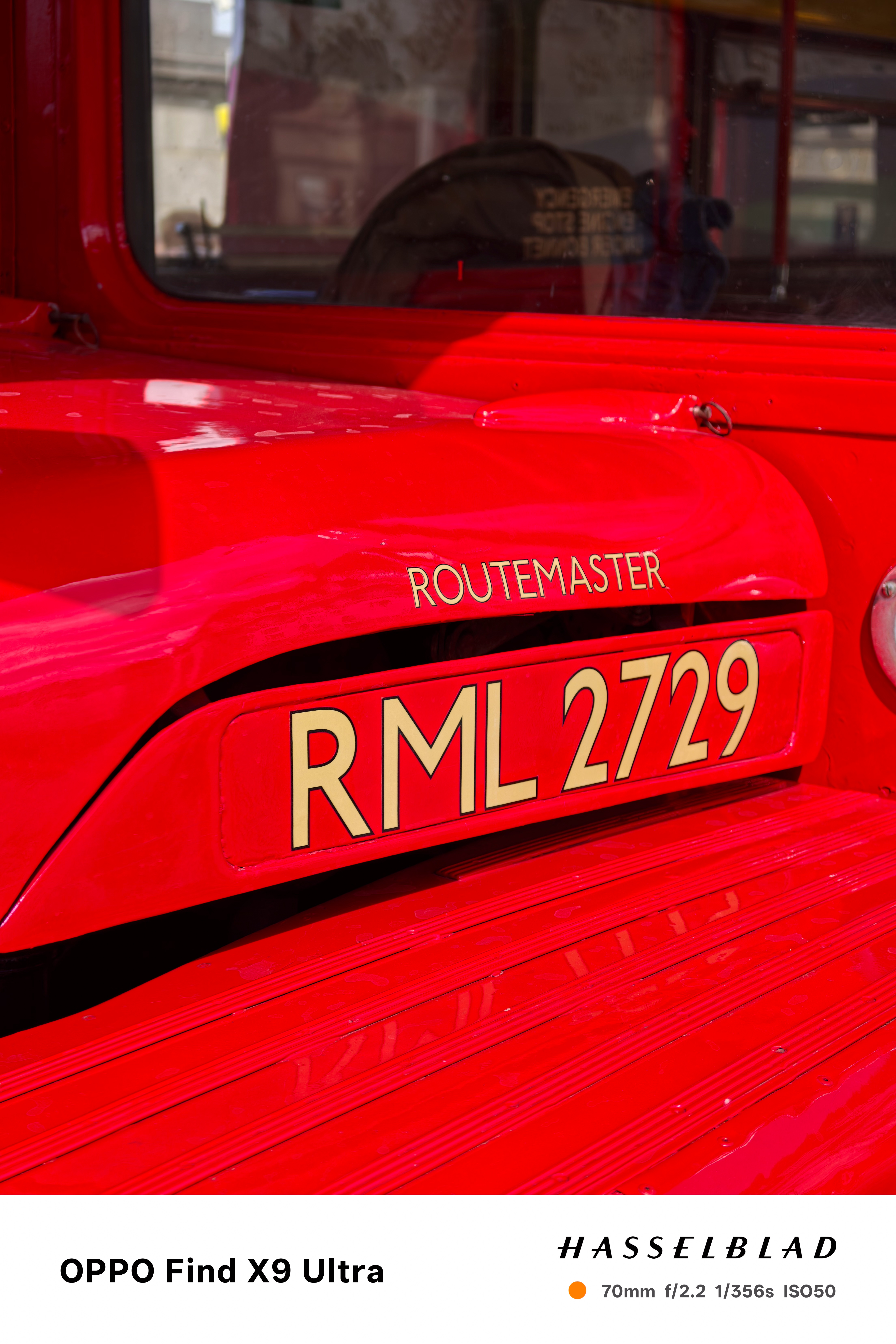 Close-up of a classic red Routemaster bus with rear number plate
