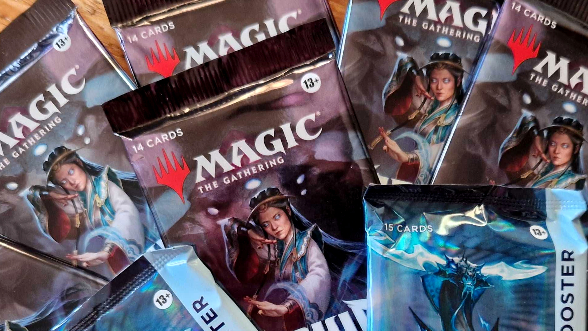 An array of MTG Tarkir: Dragonstorm boosters laid out in a fan